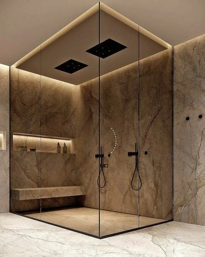 Walk-in glass shower with tile walls in a modern Woodlands bathroom remodel