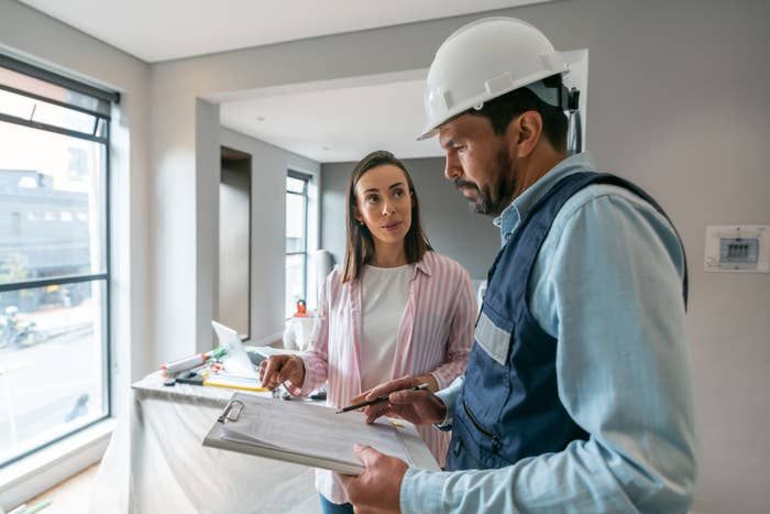 Remodeling contractor discussing project details with homeowner