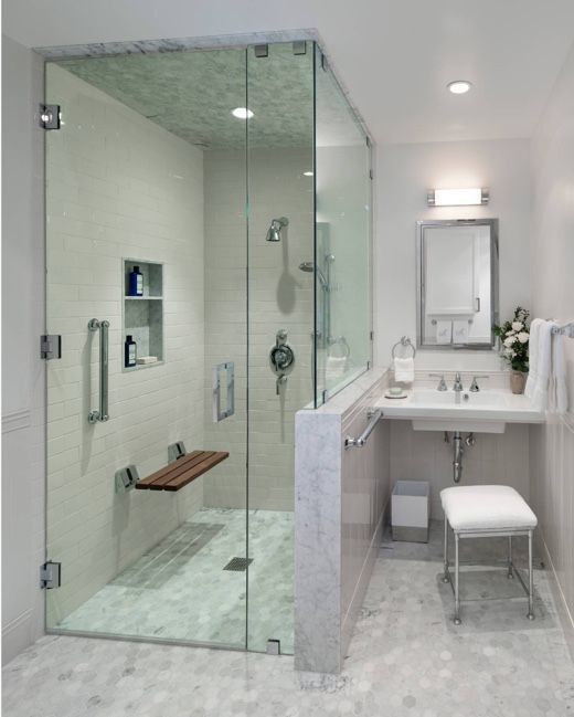 Accessible walk-in shower with grab bars and built-in seat for aging-in-place bathroom safety
